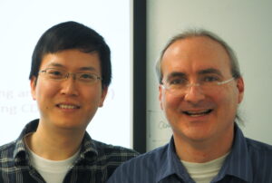 Xun Fan (left) and John Heidemann, after Xun's PhD defense.